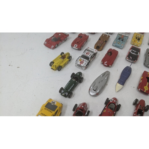 376 - A collection of 1:43 scale diecast model racing cars to include a Best Models E-Type Jaguar, a Top m... 