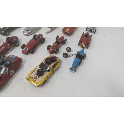 376 - A collection of 1:43 scale diecast model racing cars to include a Best Models E-Type Jaguar, a Top m... 