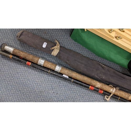 11 - Two fishing rods to include an Allcock & Sons split can rod, together with an artists easel
Location... 