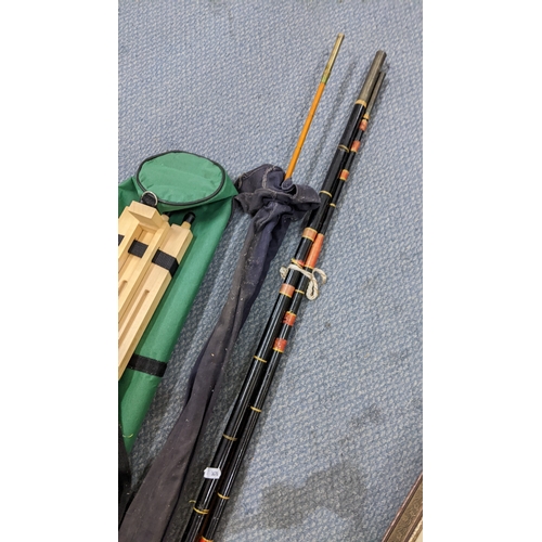 11 - Two fishing rods to include an Allcock & Sons split can rod, together with an artists easel
Location... 