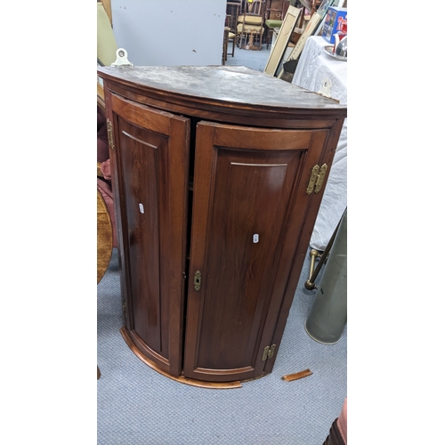 292 - A Georgian oak snap topped occasional table together a mahogany bow fronted corner cabinet
Location:... 
