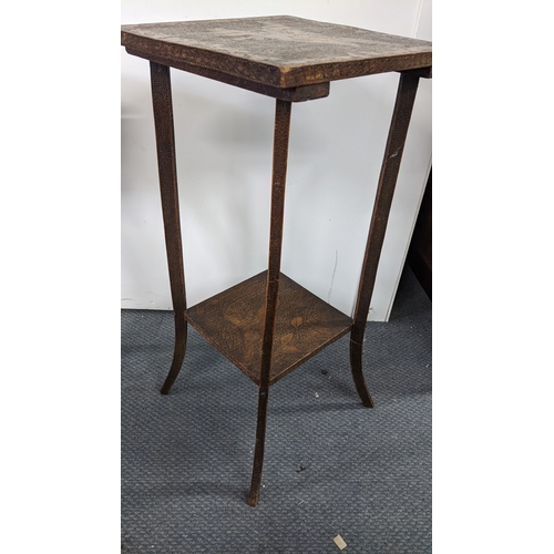 294 - An early 20th century Liberty style occasional table, the top and under-tier decorated in pokerwork ... 