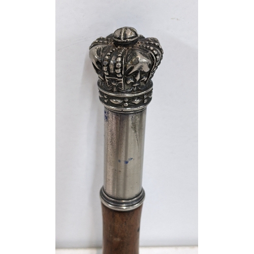 310 - A 19th century tipstaff having a turned wooden handle and white metal mounted crown finial, 18cm h 
... 