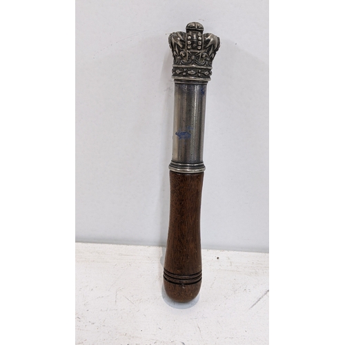 310 - A 19th century tipstaff having a turned wooden handle and white metal mounted crown finial, 18cm h 
... 