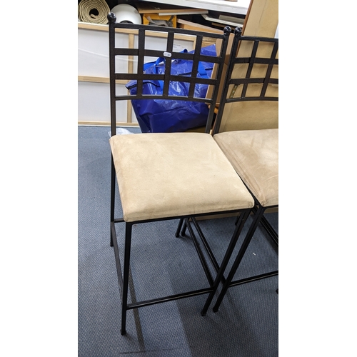 316 - A set of three wrought iron contemporary bar stools with beige upholstered seats
Location:
If there ... 