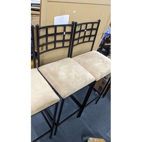 316 - A set of three wrought iron contemporary bar stools with beige upholstered seats
Location:
If there ... 