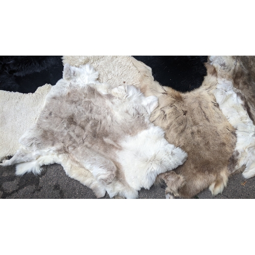 201 - A collection of eight faux fur/animal skin rugs, the largest 126 x 186cm, smallest 88 x 58cm Locatio... 