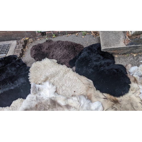 201 - A collection of eight faux fur/animal skin rugs, the largest 126 x 186cm, smallest 88 x 58cm Locatio... 