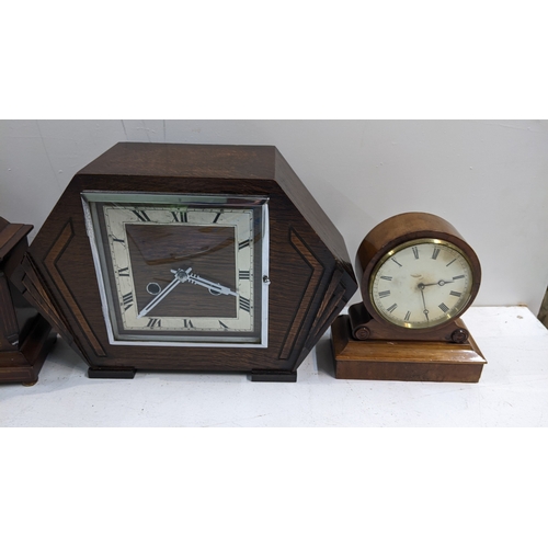 27 - Three mantel clocks to include an Edwardian arched top clock, the dial signed Wilson & Sharp 7.5cm h... 