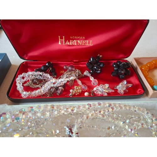 50 - A quantity of vintage costume jewellery to include a 3-strand  and two 2-strand Aurora Borealis neck... 