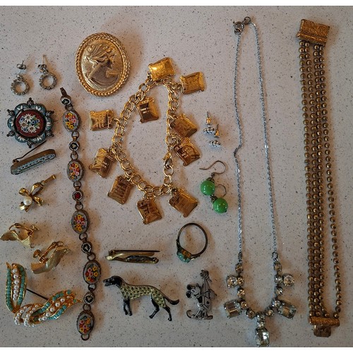 56 - A quantity of costume jewellery to include Victorian brooches, a Trifari gold tone leaf bracelet, la... 