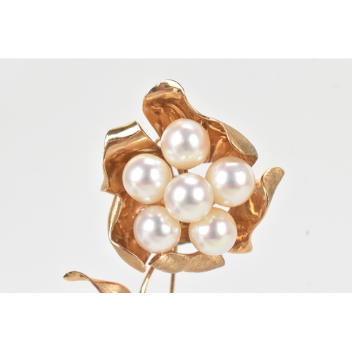 58 - A 14ct gold pearl floral brooch, modelled as a stylised flower set with six round pearls to a textur... 