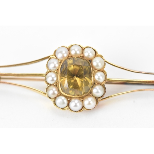 59 - A late 19th/early 20th century gold citrine bar brooch, unmarked, tested as 9ct gold, centred with a... 