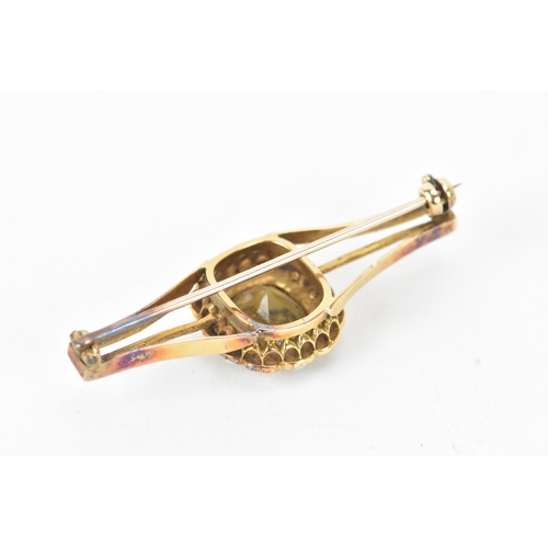 59 - A late 19th/early 20th century gold citrine bar brooch, unmarked, tested as 9ct gold, centred with a... 