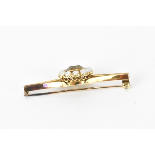 59 - A late 19th/early 20th century gold citrine bar brooch, unmarked, tested as 9ct gold, centred with a... 