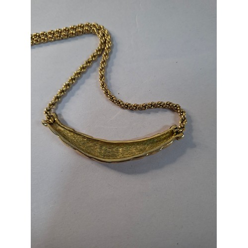 3 - Christian Dior- A 1980's gold tone necklace having a plaited pendant, rope twist chain and CD charm ... 