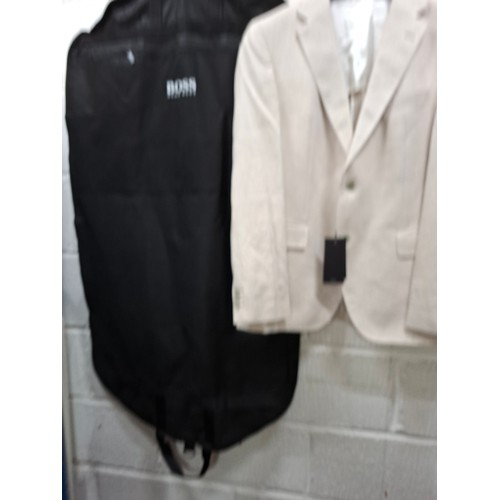 37 - Hugo Boss- An unworn wool/linen mix gents jacket in oatmeal, European size 56, style 'Jestor4', orig... 