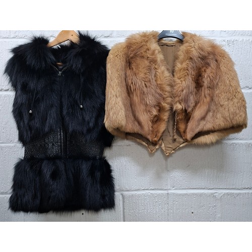 61 - A vintage red fox cape together with a modern black fox fur and leather gilet size 36. Location:Rail... 