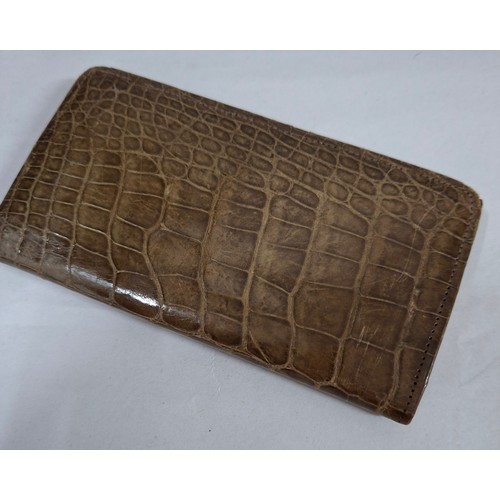 63 - A Victorian tan snakeskin purse with ornate silver frame and clasp 14cm x 7cm. Location:CAB
If there... 