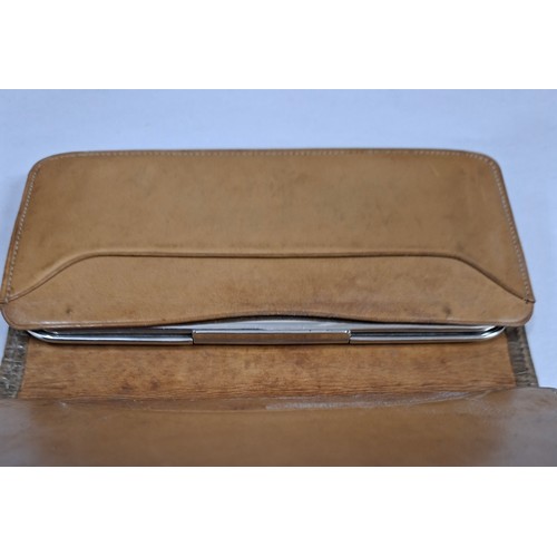 63 - A Victorian tan snakeskin purse with ornate silver frame and clasp 14cm x 7cm. Location:CAB
If there... 