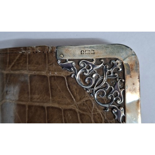 63 - A Victorian tan snakeskin purse with ornate silver frame and clasp 14cm x 7cm. Location:CAB
If there... 