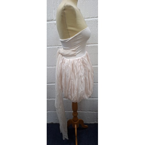 39 - Dolce & Gabbana- A pale pink baby dolly dress with long trailing tie to the back, European size 40 a... 