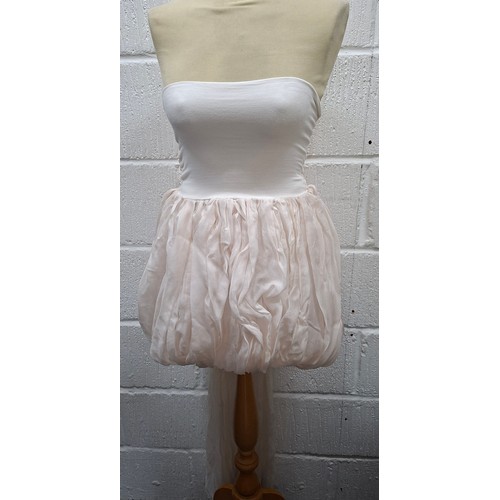 39 - Dolce & Gabbana- A pale pink baby dolly dress with long trailing tie to the back, European size 40 a... 