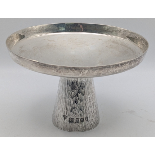 A silver pedestal dish of circular form with tapered, textured foot, hallmarked London 1977, By Briun Lelie Fuller, 8.5cm h x 13.5cm diameter, 234.5g
Location: P8
If there is no condition report shown, please request