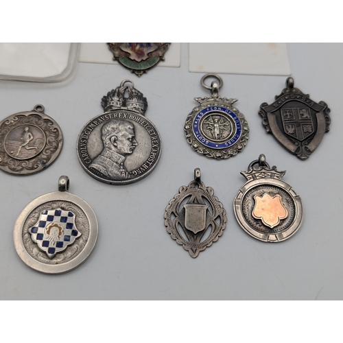 23 - Silver medals and fobs to include a white metal Austria-Hungary military merit medal, an order of Od... 