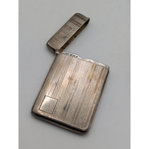 25 - Silver to include a card case having engine turned decoration hallmarked Birmingham 1924 together wi... 