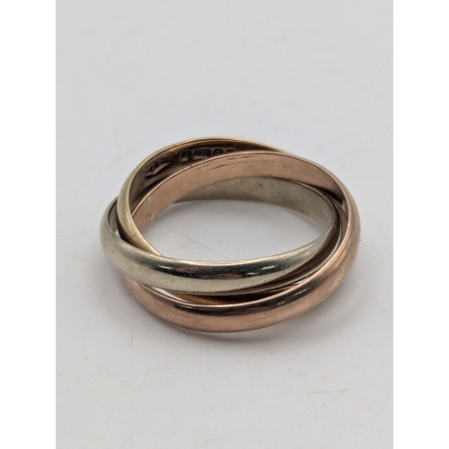 7 - A 9ct gold tri coloured interlinked Russian weeding band, size J, weight 3.6g
Location:RING
If there... 