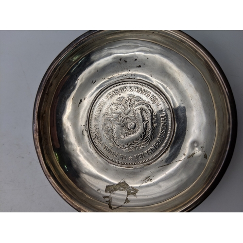 58 - Five Chinese sterling silver coin/pin dishes featuring a dragon motif to the centre, 219.g
Location:... 