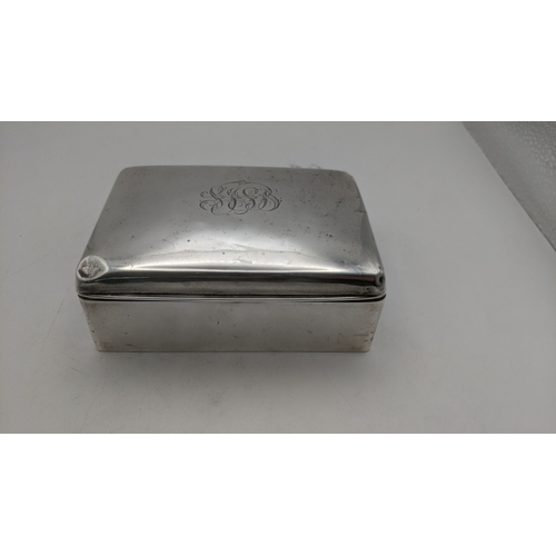 60 - A silver cigarette box with plywood interior, hallmarked Birmingham 1938
Location:A4M
If there is no... 