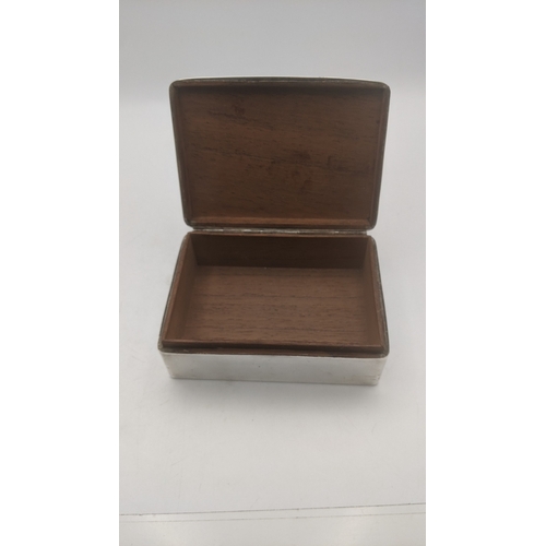 60 - A silver cigarette box with plywood interior, hallmarked Birmingham 1938
Location:A4M
If there is no... 