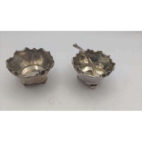 61 - A pair of Victorian silver salts and a spoon hallmarked London 1882 weighing a total of 83g
Location... 