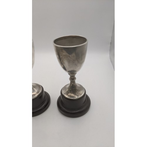 57 - Three silver trophy cups hallmarked Birmingham 1937 weighing a total of 108.9g on weighted plinths
L... 