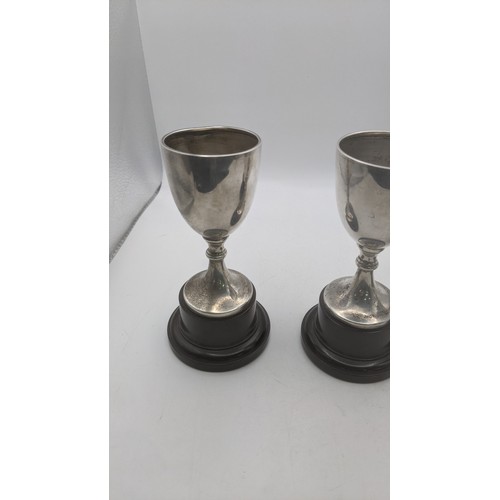 57 - Three silver trophy cups hallmarked Birmingham 1937 weighing a total of 108.9g on weighted plinths
L... 