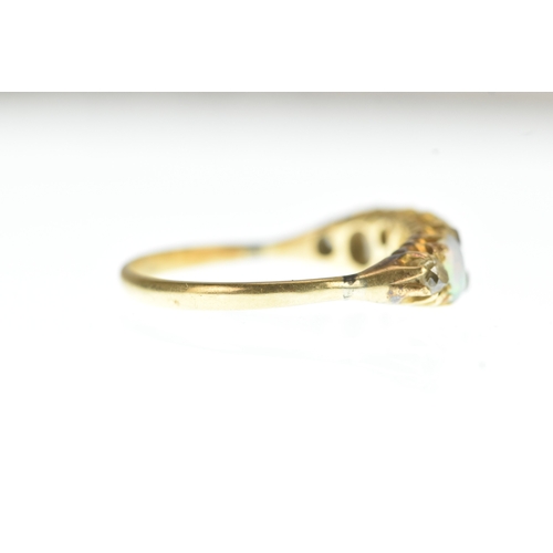 1 - A Victorian diamond and opal 18ct yellow gold ring, set with three graduated oval cabochon-cut opals... 