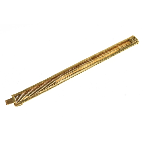 12 - A 18ct yellow gold bracelet, with a series of articulated curved and ribbed links, having a box and ... 