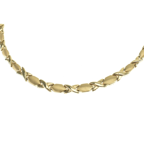 2 - A 14ct yellow gold hugs and kisses (XO) link necklace, having a box and tongue clasp,  featuring a p... 