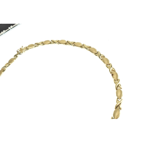 2 - A 14ct yellow gold hugs and kisses (XO) link necklace, having a box and tongue clasp,  featuring a p... 