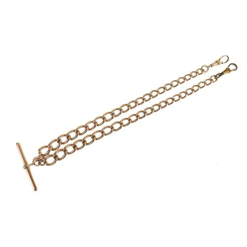 22 - A 9ct rose gold curb link pocket watch chain, with a 9ct rose gold T-bar, a rose coloured metal bull... 
