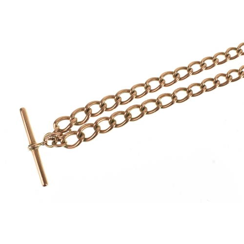 22 - A 9ct rose gold curb link pocket watch chain, with a 9ct rose gold T-bar, a rose coloured metal bull... 