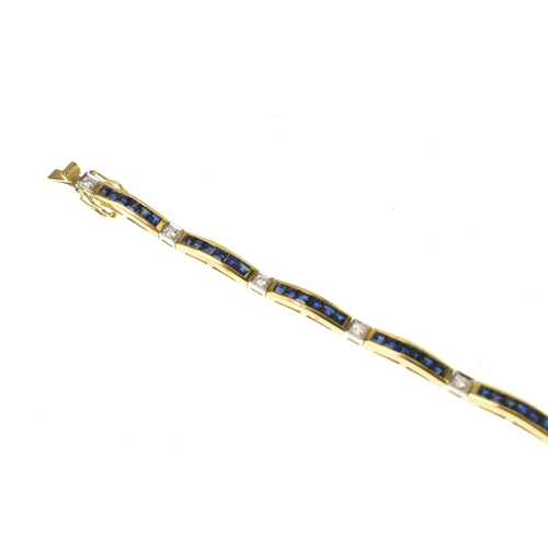 25 - A diamond and blue sapphire 18ct yellow gold tennis bracelet, featuring channel set square-cut blue ... 