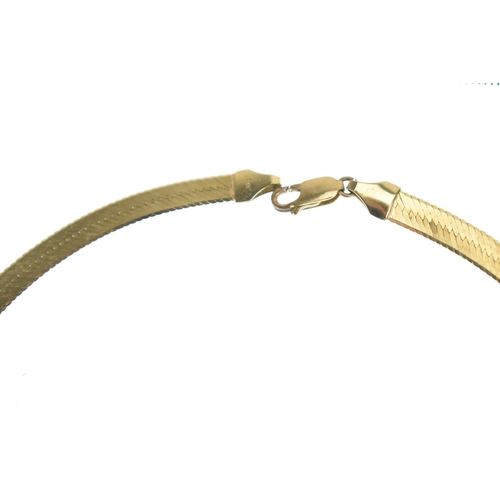 28 - A 9ct yellow gold herringbone chain necklace with lobster claw clasp, stamped 375 Italy, approx 42cm... 