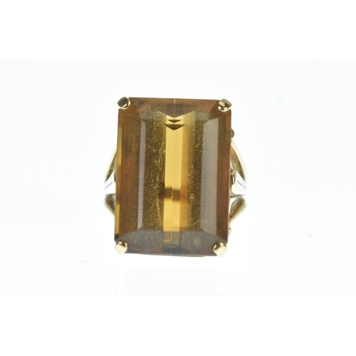 30 - A large emerald cut citrine and yellow metal dress ring, stone measurements 22.5mm x 16.3mm x 10.9mm... 