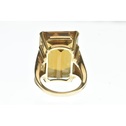 30 - A large emerald cut citrine and yellow metal dress ring, stone measurements 22.5mm x 16.3mm x 10.9mm... 
