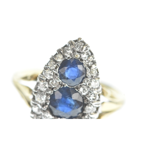 32 - A Victorian diamond and blue sapphire yellow and white metal marquise shaped cluster ring, set with ... 