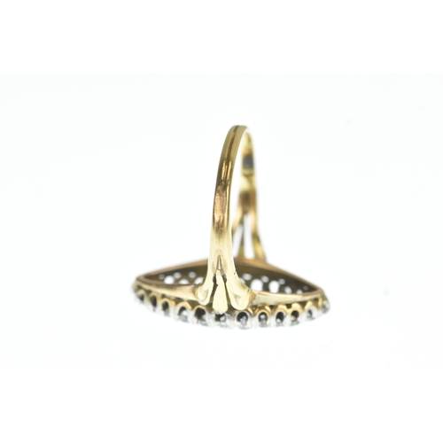 32 - A Victorian diamond and blue sapphire yellow and white metal marquise shaped cluster ring, set with ... 