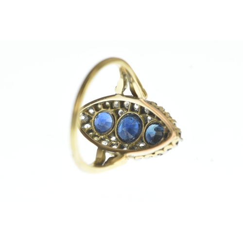 32 - A Victorian diamond and blue sapphire yellow and white metal marquise shaped cluster ring, set with ... 